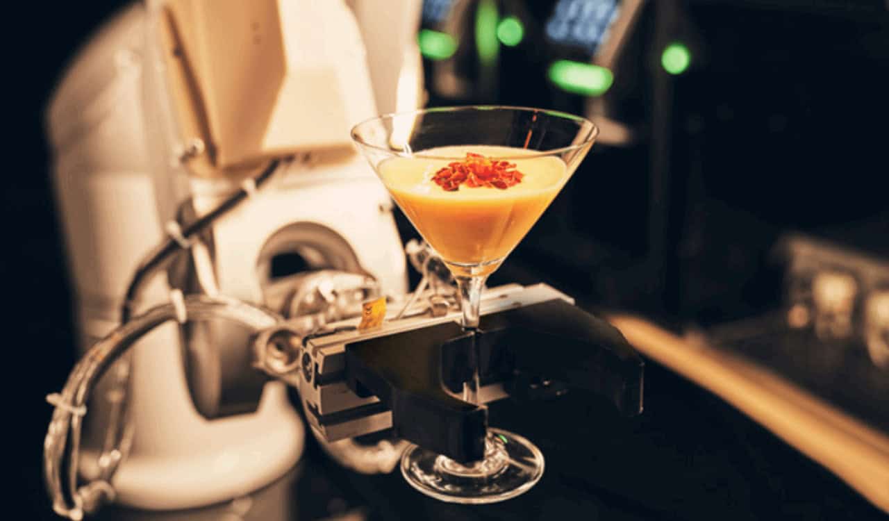 Robot arm serves customers coffee