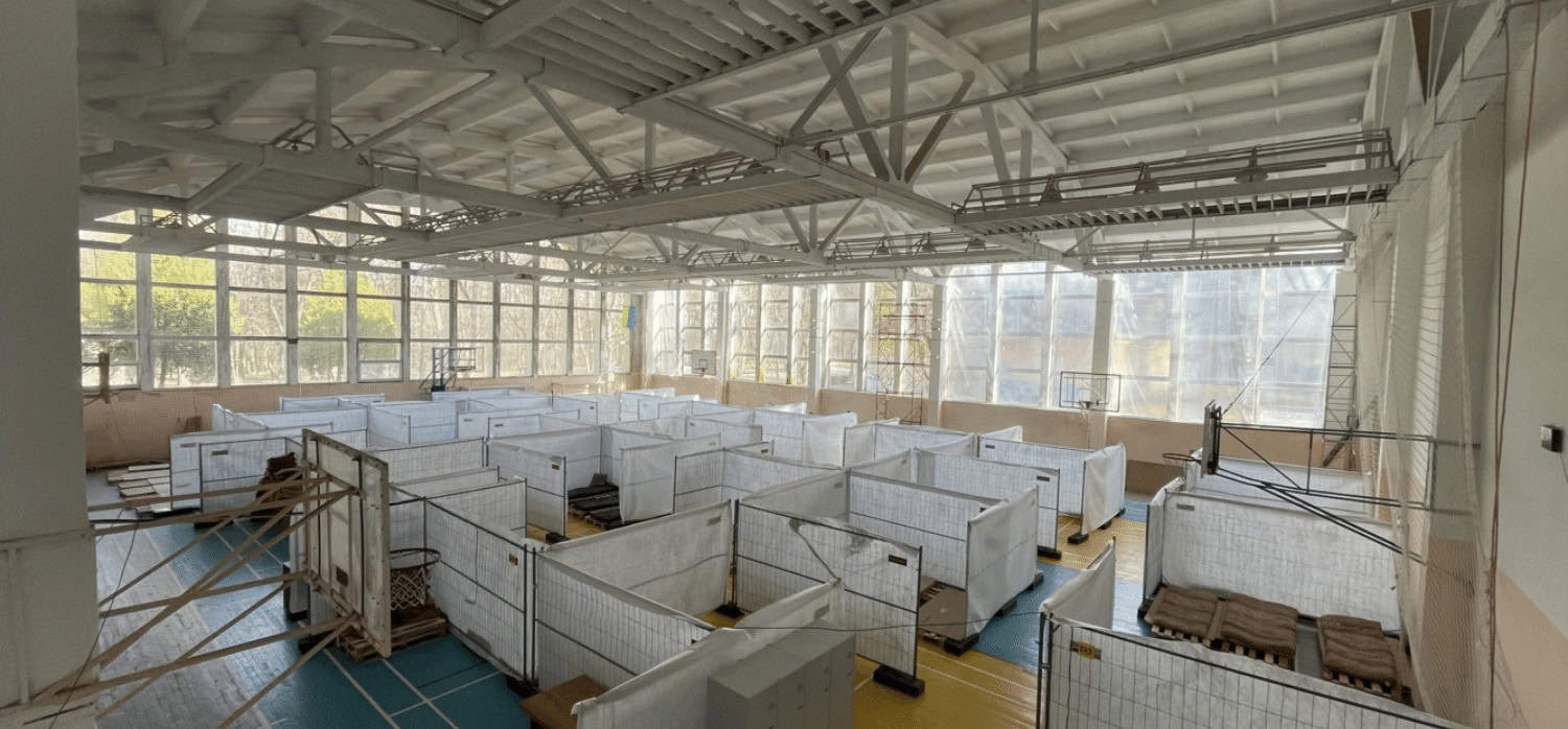 Community buildings repurposed as multi-use shelters for war refugees